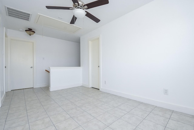 empty room featuring ceiling fan and light tile patterned floors