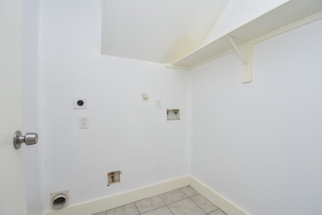 washroom featuring hookup for an electric dryer, gas dryer hookup, light tile patterned floors, and hookup for a washing machine