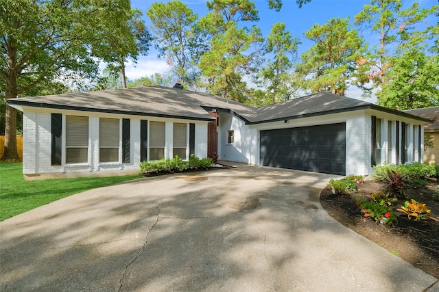 ranch-style home with a garage