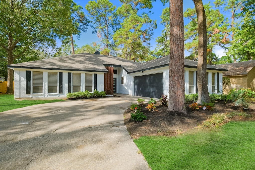 ranch-style house featuring a garage