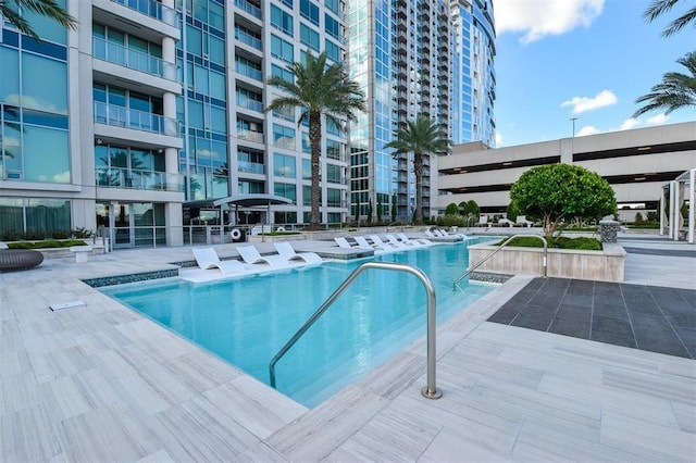 view of pool featuring a patio