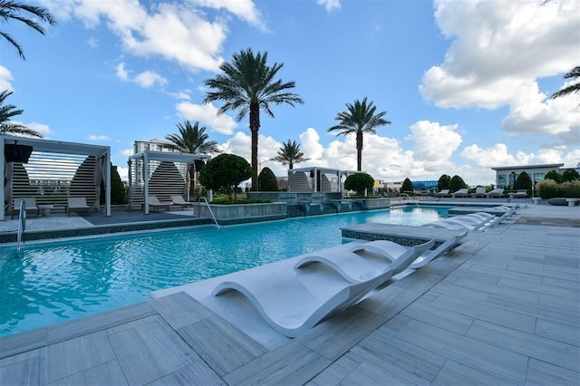 view of swimming pool featuring a patio area