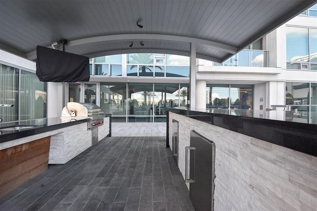 view of patio with a grill and an outdoor kitchen