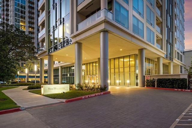 view of outdoor building at dusk