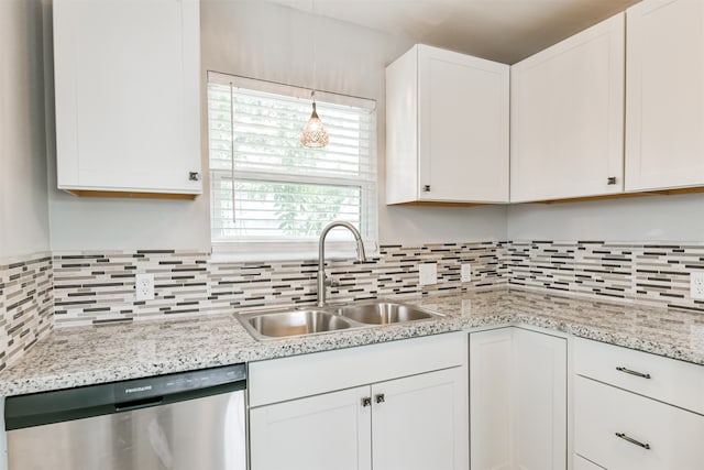 kitchen with backsplash, white cabinetry, dishwasher, and sink