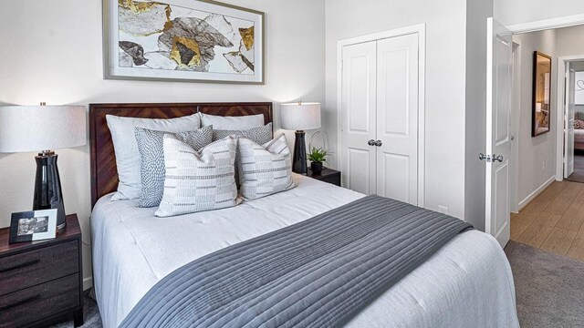 bedroom featuring hardwood / wood-style floors and a closet