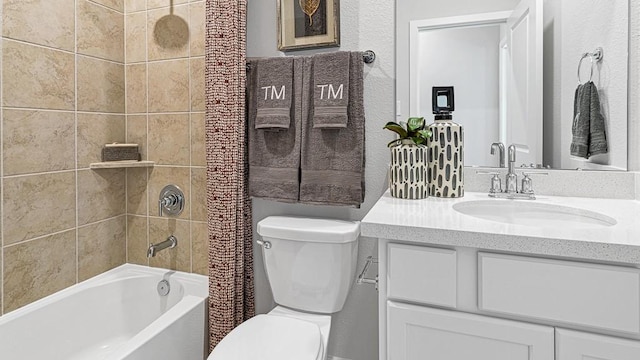 full bathroom featuring vanity, shower / bathtub combination with curtain, and toilet