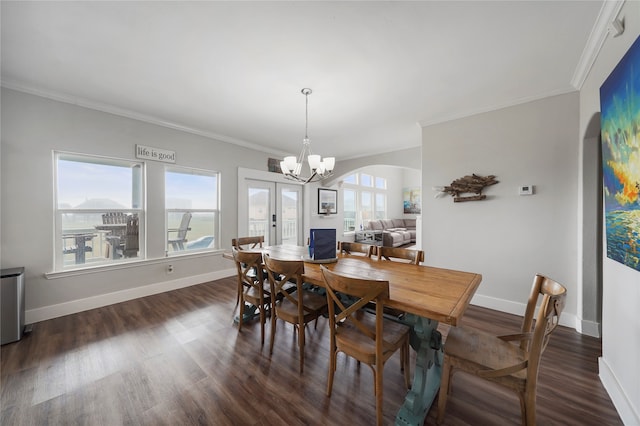 dining space featuring plenty of natural light, dark hardwood / wood-style floors, and crown molding