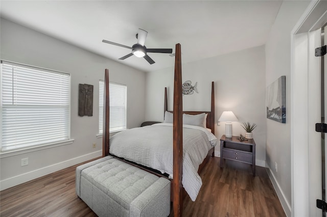 bedroom featuring ceiling fan and dark wood-type flooring