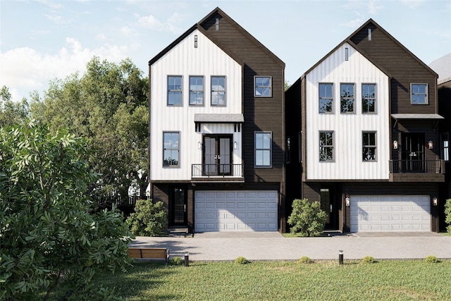 view of front of home with a front yard, french doors, a balcony, and a garage