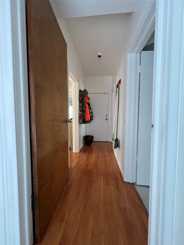 corridor with light hardwood / wood-style floors