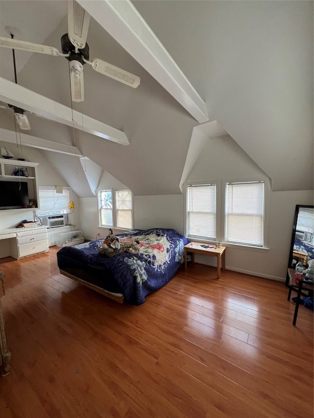 bedroom featuring multiple windows, wood-type flooring, ceiling fan, and lofted ceiling