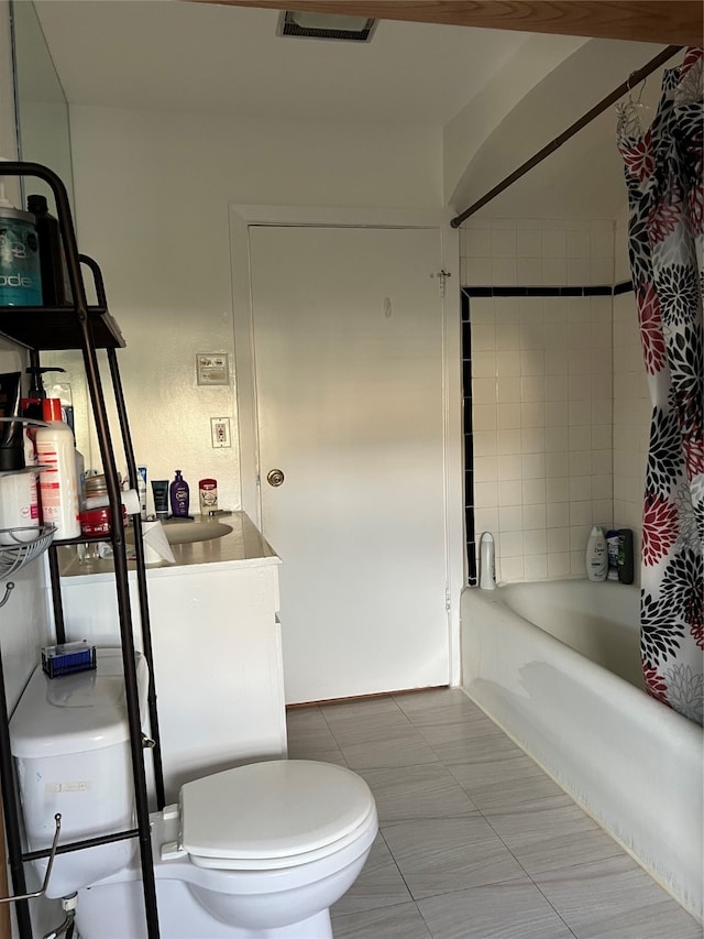 full bathroom with tile patterned flooring, vanity, toilet, and shower / bathtub combination with curtain