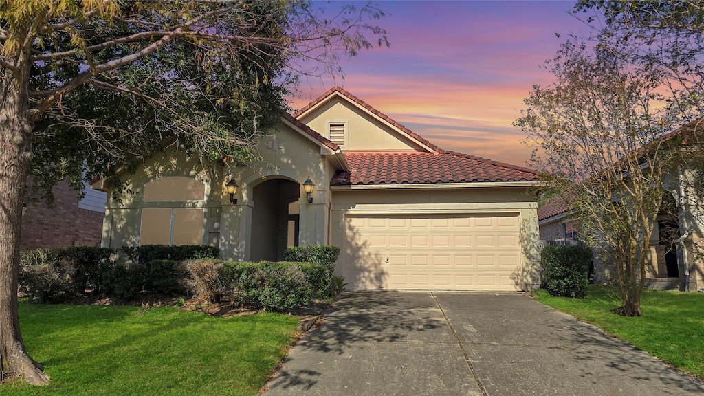 mediterranean / spanish-style home featuring a yard