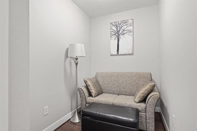 300 St Joseph Pkwy Unit 115, Houston, TX 77002 - living area featuring dark wood-style floors and baseboards