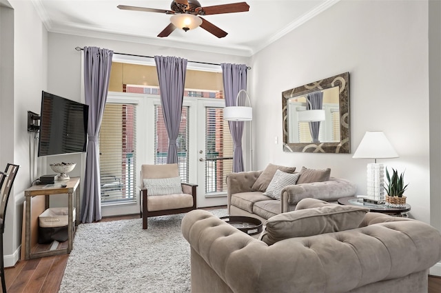 living room with wood-type flooring, french doors, ceiling fan, and ornamental molding