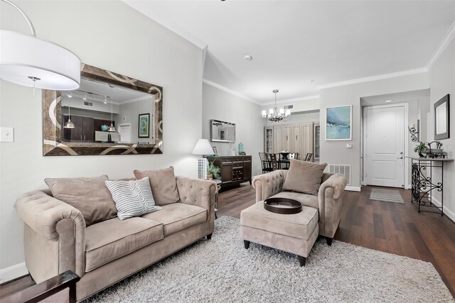 300 St Joseph Pkwy Unit 115, Houston, TX 77002 - living room with ornamental molding, wood finished floors, a chandelier, and baseboards