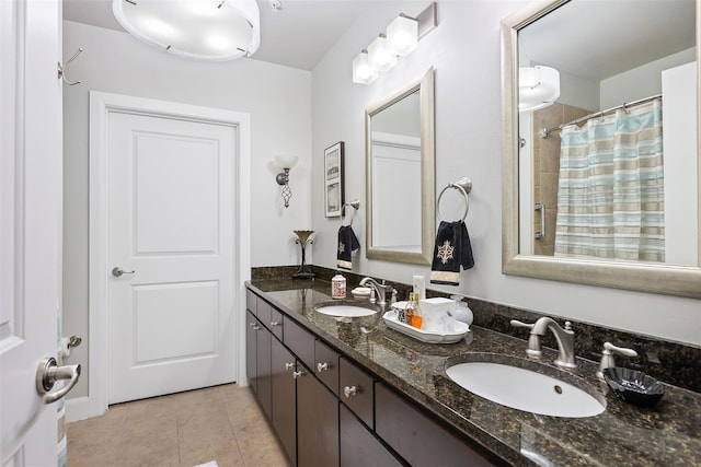300 St Joseph Pkwy Unit 115, Houston, TX 77002 - bathroom with tile patterned floors, double vanity, and curtained shower