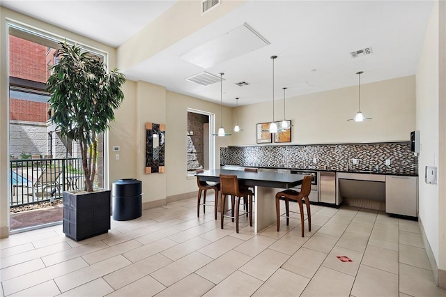 300 St Joseph Pkwy Unit 115, Houston, TX 77002 - dining area with light tile patterned flooring and baseboards