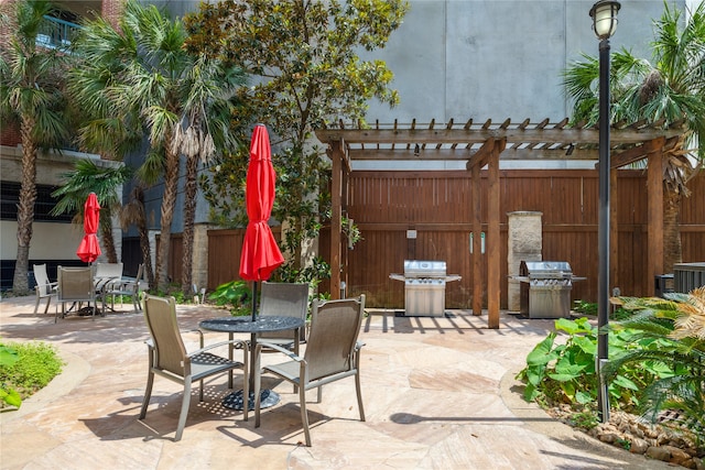 view of patio / terrace with a pergola and grilling area