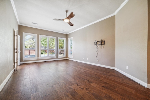 spare room featuring ceiling fan, dark hardwood / wood-style flooring, and ornamental molding