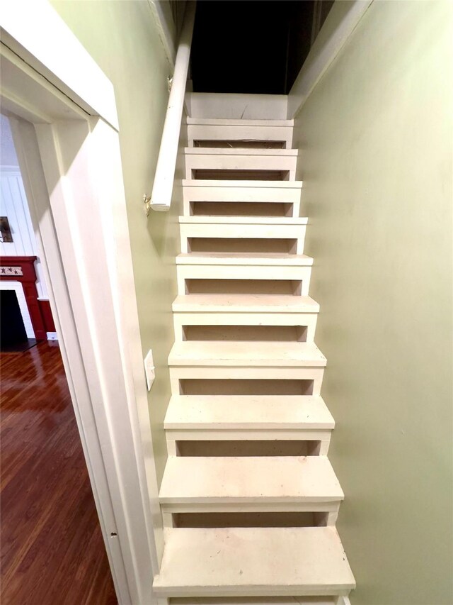 staircase featuring hardwood / wood-style flooring