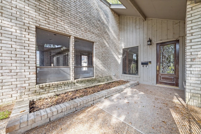 entrance to property with a patio area