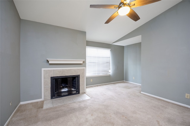 unfurnished living room featuring light carpet, a fireplace, lofted ceiling, and ceiling fan