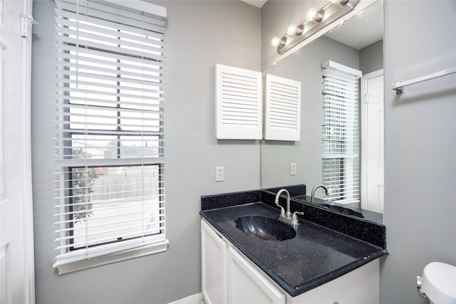 bathroom with vanity and toilet