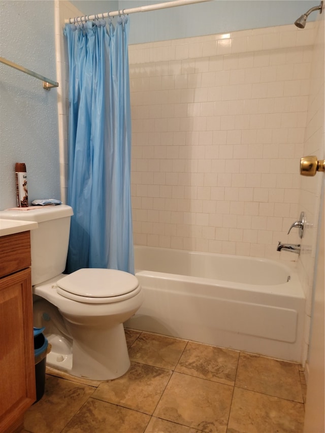 full bathroom featuring tile patterned flooring, vanity, toilet, and shower / bath combo