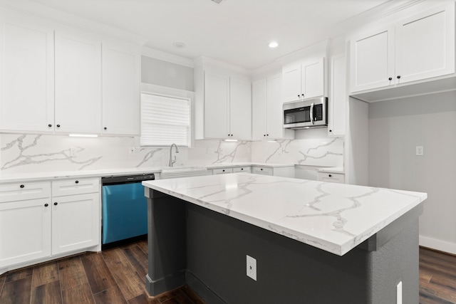 kitchen featuring white cabinets, appliances with stainless steel finishes, dark hardwood / wood-style floors, and tasteful backsplash