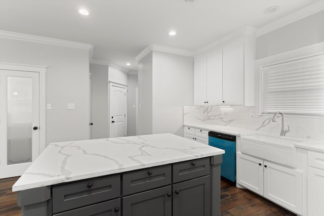 kitchen with dark hardwood / wood-style flooring, light stone counters, dishwasher, and white cabinets