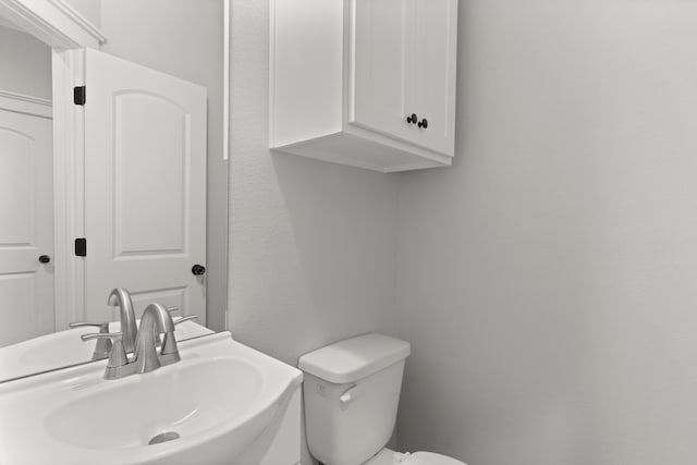 bathroom with sink and toilet