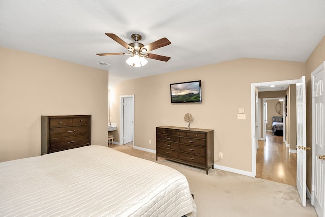 carpeted bedroom featuring vaulted ceiling and ceiling fan