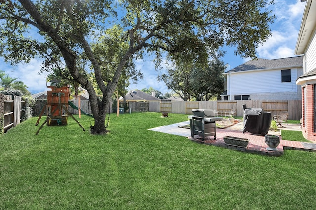 view of yard with a patio and a playground