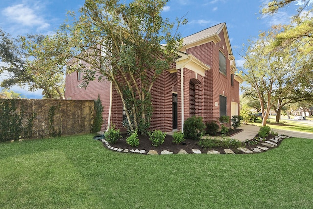 view of side of property with a yard