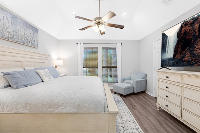 bedroom with ceiling fan and dark hardwood / wood-style floors