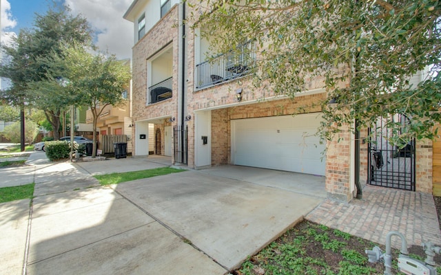 exterior space featuring a balcony and a garage