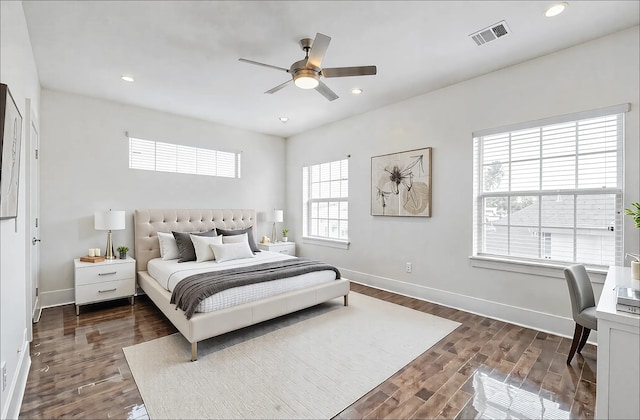 bedroom with ceiling fan and dark hardwood / wood-style floors