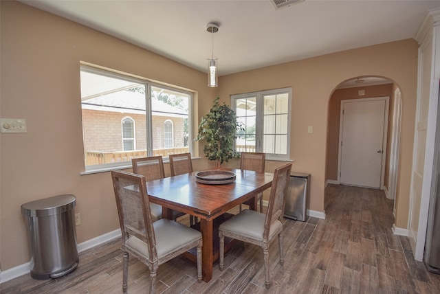 dining space featuring dark hardwood / wood-style flooring