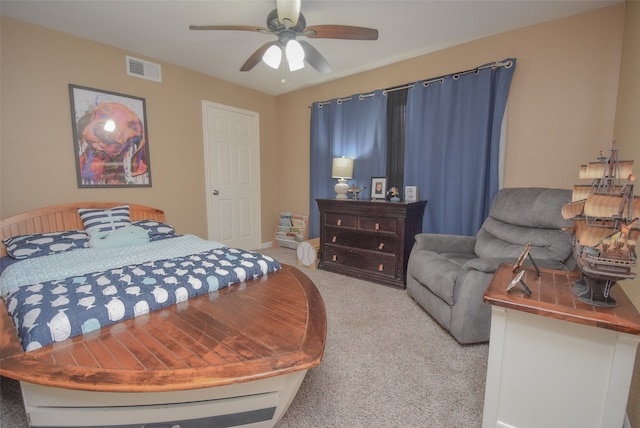 bedroom with ceiling fan and light colored carpet