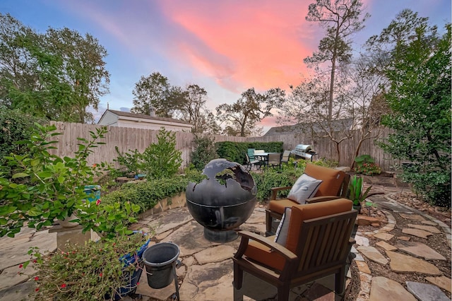 view of patio terrace at dusk