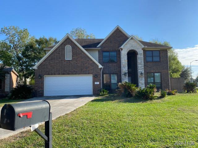 2102 Short Path Ct, Spring, TX 77373 - traditional-style home featuring driveway, a front yard, and brick siding