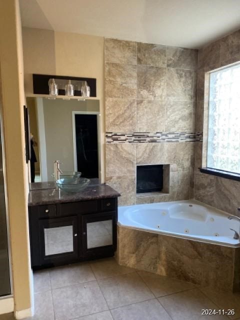 bathroom featuring tile patterned floors, vanity, and tile walls