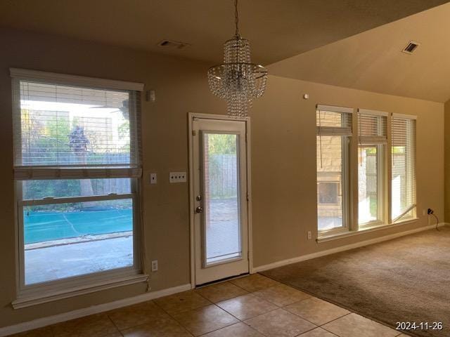 2102 Short Path Ct, Spring, TX 77373 - doorway with baseboards, tile patterned floors, a chandelier, and carpet floors