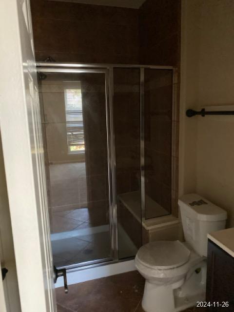 2102 Short Path Ct, Spring, TX 77373 - bathroom with vanity, toilet, and a stall shower