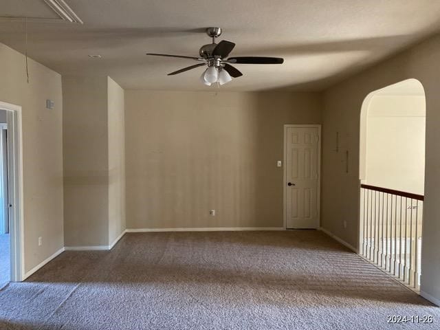 carpeted empty room with ceiling fan