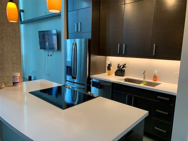 kitchen with appliances with stainless steel finishes and sink