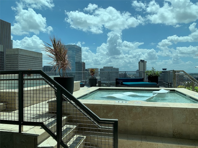 view of pool featuring a jacuzzi