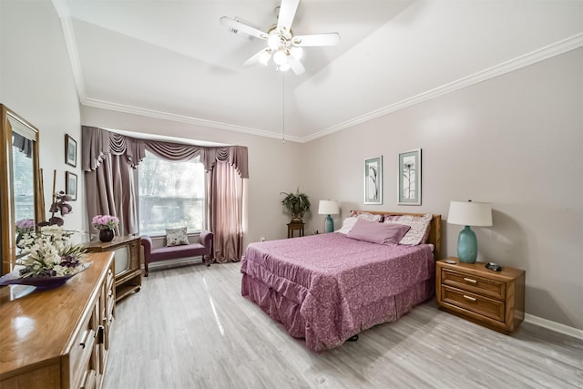 bedroom with ceiling fan, vaulted ceiling, crown molding, and light hardwood / wood-style flooring